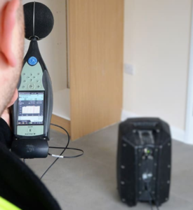 Sound Insulation Testing Engineer using Sound Insulation Testing Equipment