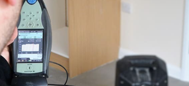 Sound Insulation Testing Engineer using Sound Insulation Testing Equipment