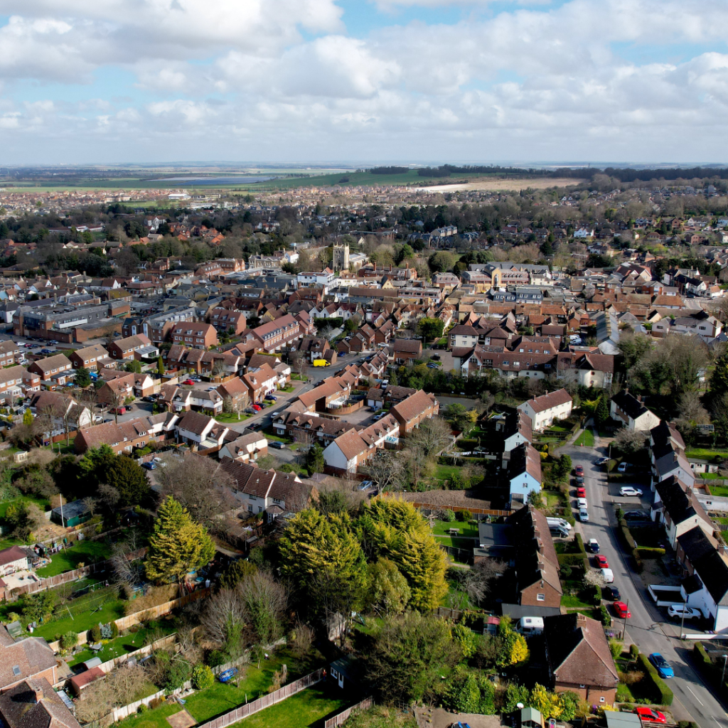 Aerial view of a residential housing area showing typical homes assessed for SAP calculations and energy performance compliance